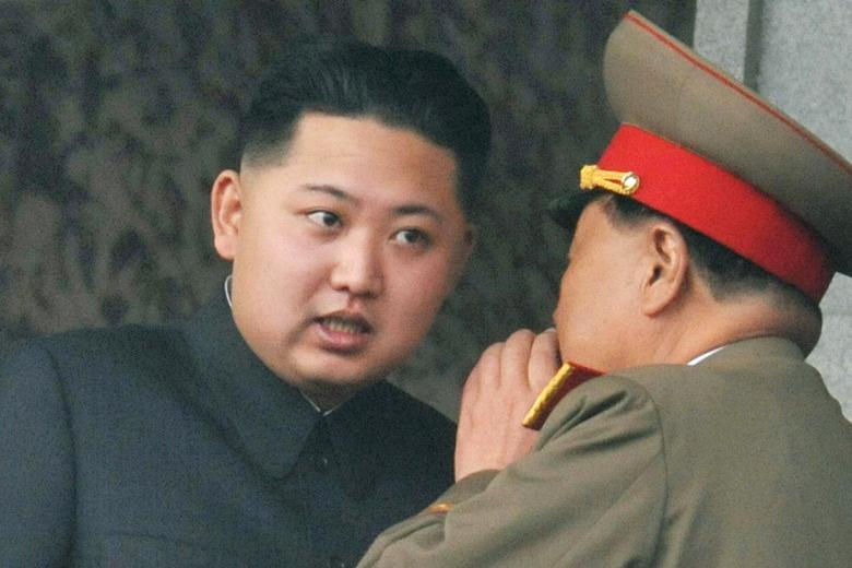 Top aides always cover their mouths to stop foreign spies from lip reading what they may be saying