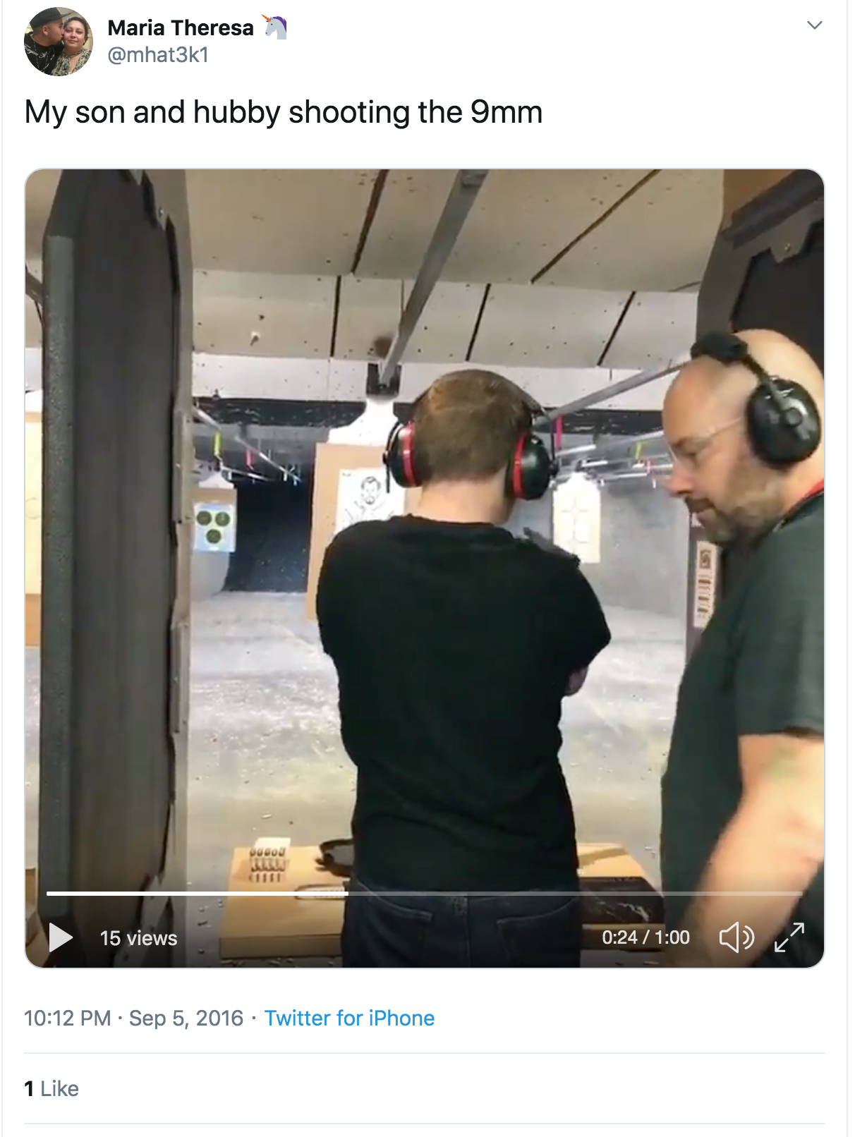 A screenshot of a Twitter post by Maria Theresa showing a video of her son and husband at an indoor shooting range. The husband is a bald Caucasian man wearing glasses and ear protection, standing next to his son who is aiming a firearm.