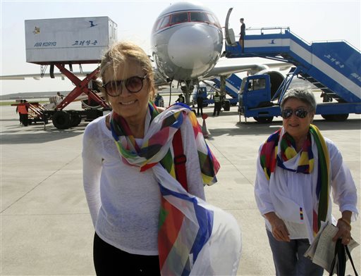 FILE - In this May 19, 2015 file photo, activists Gloria Steinem, left, and Aiyoung Choi arrive at Pyongyang Airport in Pyongyang, North Korea. Steinem and a group of 29 other women from 15 countries are set to walk across the Demilitarized Zone dividing North and South Korea on Sunday, May 24 after obtaining a rare green light from both governments. (AP Photo/Jon Chol Jin, File )