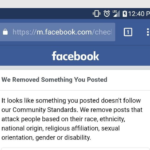 A screenshot of a Facebook mobile notification stating 'We Removed Something You Posted' due to a violation of Community Standards regarding attacks on people based on race, ethnicity, national origin, religious affiliation, sexual orientation, gender, or disability.
