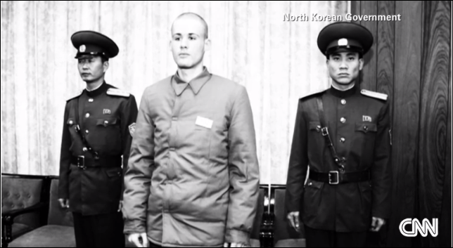 U.S. prisoner Matthew Miller attending his release ceremony with top U.S. spy James Clapper in Pyongyang, November 9, 2014