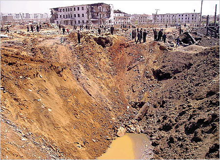 A 72 meter crater at explosion site in North Korea that registered 3.6 on the Richter scale in April 2004. Remnants of a mobile phone wrapped in duct tape were found nearby by investigators