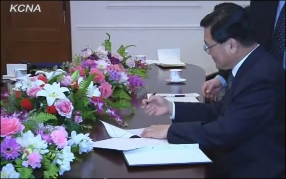 President of the North Korean official propaganda arm, the KCNA, signing the agreement made with AP to open a news bureau in Pyongyang on January 16, 2012. Kim Pyong Ho was promoted to deputy director of the Department of Propaganda and Agitation of the ruling Korean Worker's Party shortly after AP inaugurated their news bureau (Photo KCNA)