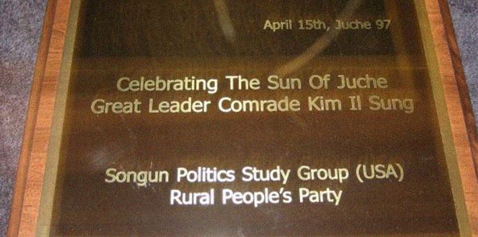 A plaque presented by the Rural People's Party and Songun Politics Study Group to Kim Jong Il on