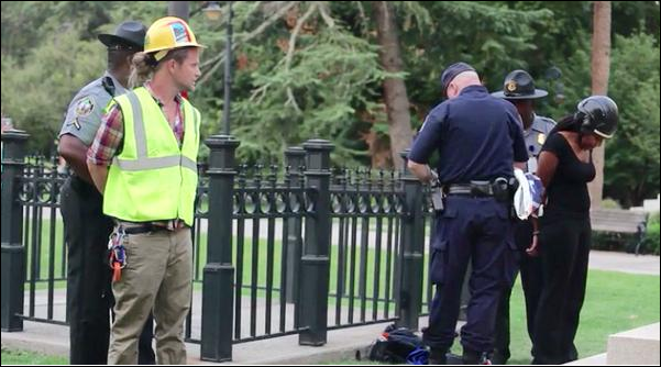 James Ian Tyson under arrest in front of the South Carolina state capitol building for removing the Confederate flag June 27, 2015