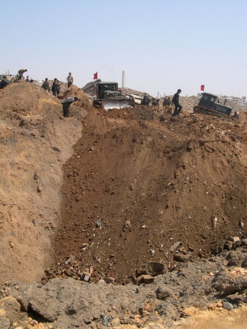 Photo of crater after explosion, Ryongchon 2004 | Picture credit: David Hill, ECHO